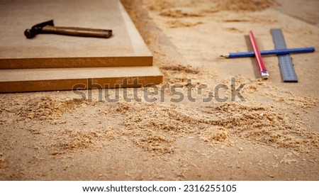 MDF chipboard with woodworking tools and sawdust Royalty-Free Stock Photo #2316255105
