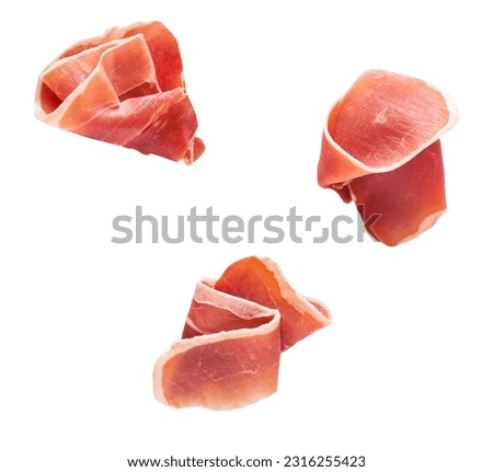 Parma ham prosciutto isolated on white background top view. Royalty-Free Stock Photo #2316255423