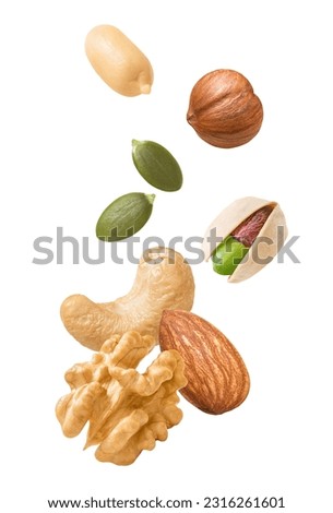 Peeled peanut, hazelnut, green pumpkin seeds, pistachio, cashew, walnut and almond isolated on white background. Nuts flying for vertical layout. Package design element with clipping path Royalty-Free Stock Photo #2316261601