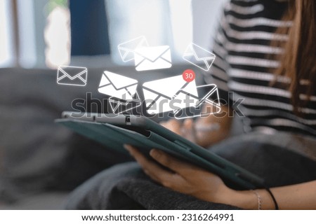 Female using touch tablet screen with virtual mail icons. E-mail notification alert. Sending or receive connect newsletter. Communication network message. Customer service call contact us.