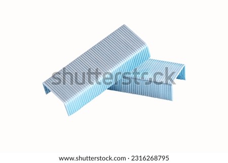 Stack of Metal staples small (stapler) isolated on white background. Used for joining or bundling materials together. Small staples are with stapler to attach the paper together. Royalty-Free Stock Photo #2316268795