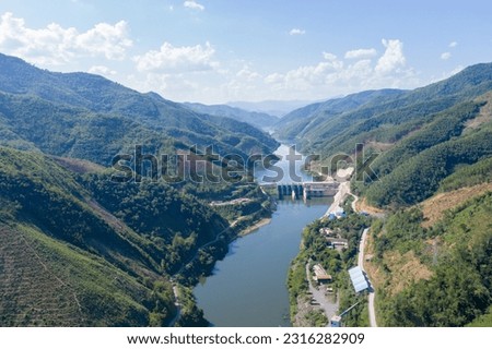 Aerial view of a hydro power plant, A dam across Nam Ou River in the northern of Laos, Flow to Mekong river pass though Phongsaly and Luangprabang province.     Royalty-Free Stock Photo #2316282909