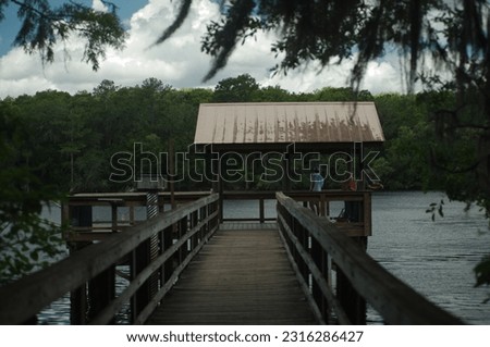 Fishing Pier and Boardwalk Manatee Springs State Park. In Florida. Sunny day with blue clouds