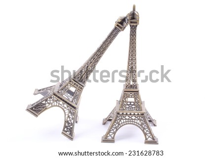 a small eiffel tower reproduction isolated over a white background