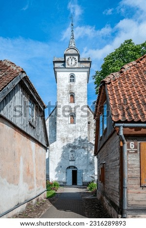Clock tower of Holy Trinity Church in Kuldiga, Latvia. It used to be called Goldingen. Royalty-Free Stock Photo #2316289893