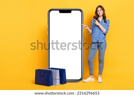 Full length photo of attractive positive person direct finger empty space announcement isolated on yellow color background