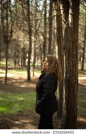 cute woman in a pine forest