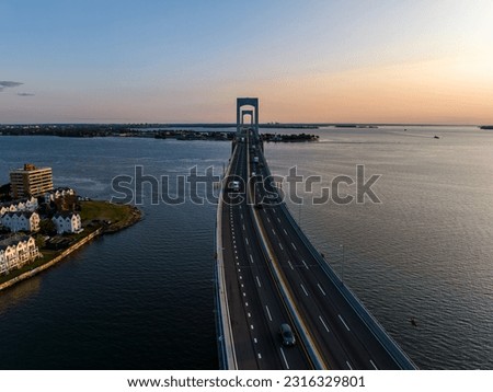 An aerial view of the Throgs Neck Bridge during a beautiful sunrise, looking from the Queens side towards the Bronx in New York.