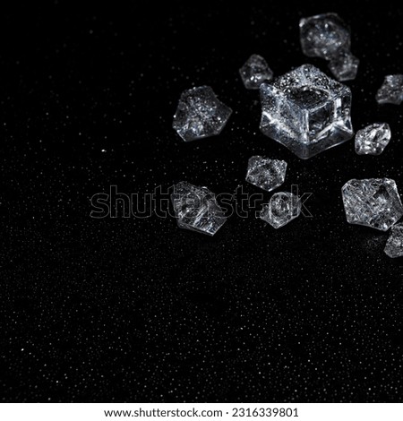 Ice cubes on a black background. Cold background. ice and won on black background