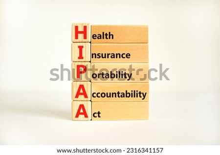 HIPAA symbol. Concept words HIPAA health insurance portability accountability act on wooden block. Beautiful white background. Business HIPAA health insurance portability accountability act concept.