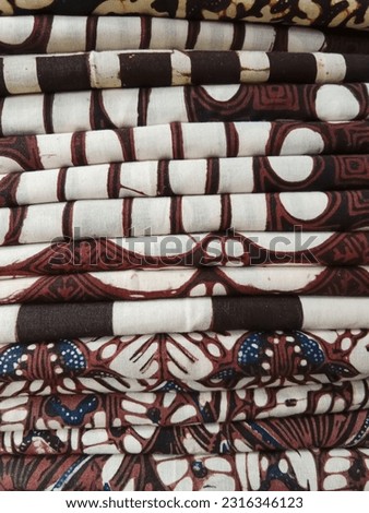 Pile of neatly folded Batik cloth in display