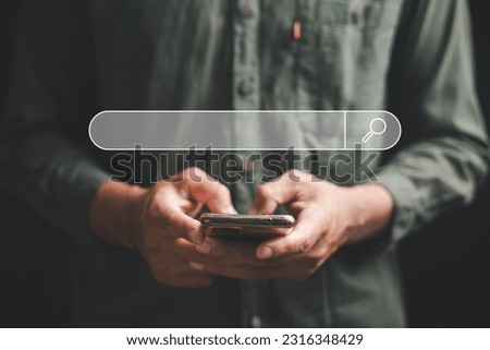 Hand of businessman using smartphone for SEO tools to optimize online content. B2B marketing and business technology concept. search engine optimization with search bar