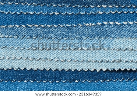 Set of Denim sample pieces, fabric samples for selection and clothes manufacture. Textile background Royalty-Free Stock Photo #2316349359