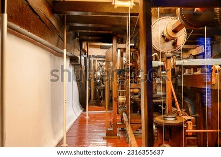 A room filled with machinery that is used to operate the Royal Eise Eisinga Planetarium Royalty-Free Stock Photo #2316355637