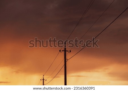 High-voltage power lines. Electricity distribution station. Electricity pylons on the background of the sky.