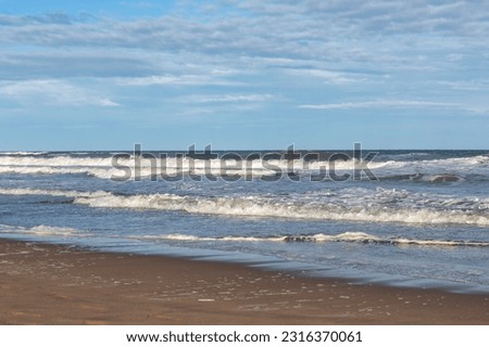 photography of sandy beach with waves