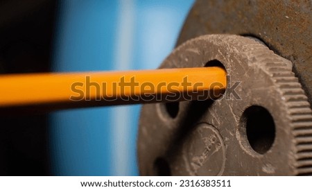 
Close Up of a Pencil in an Old Rusty Sharpener Royalty-Free Stock Photo #2316383511