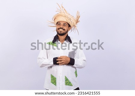 Young handsome man in traditional June party clothes smiling at the camera. Dancing