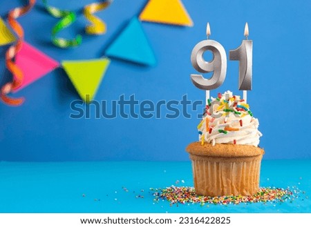 Birthday cake with candle number 91 - Blue background