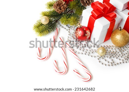 Gift with christmas tree and candy isolated on white background