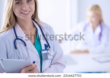 Woman doctor standing with stethoscope at hospital . Woman doctor