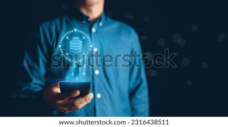 Business men touch smartphone for sync data to DATA Store Royalty-Free Stock Photo #2316438511