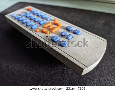 White remote control for tv on a blur background. Selective focus 
