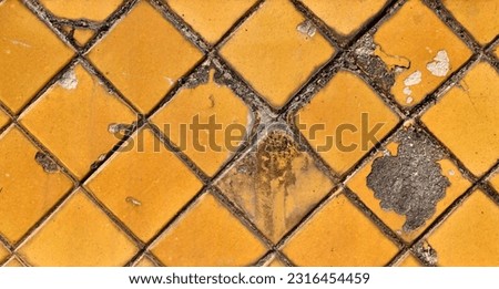 grunge yellow gold tiles floor texture, old golden color bathroom tile floor or wall with damaged surface and dirty stain, top view wide banner background