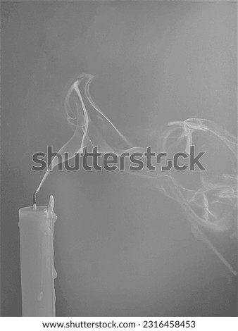 White candles have a gray background with smoke.