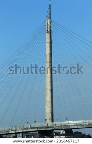 bridge tower pylons against a blue sky background Royalty-Free Stock Photo #2316467117