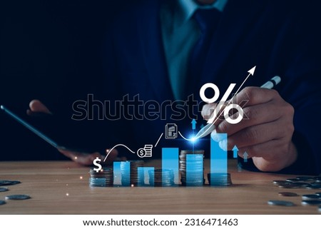 Interest rate and dividend concept. Businessman with percentage symbol and up arrow, Interest rates continue to increase, return on stocks and mutual funds, long term investment for retirement. Royalty-Free Stock Photo #2316471463