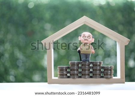 Retirement planning, Seniorman standing on stack of coins money on natural green background, Save money for prepare in future and pension retirement concept