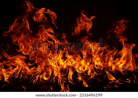 Fire blaze flames on black background. Fire burn flame isolated, abstract texture. Flaming explosion with burning effect. Fire wallpaper, abstract art pattern with copy space. Royalty-Free Stock Photo #2316496199