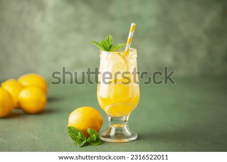 Homemade Limoncello spritz drink of liqueur, sparkling wine and lemon in cocktail glass Royalty-Free Stock Photo #2316522011