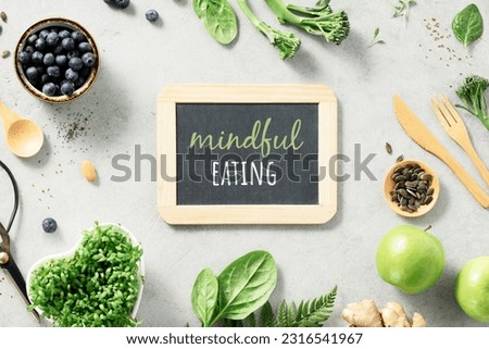 Vegetarian vegan healthy ingredients and mindful eating chalk board on grey stone background. Healthy eating, eco friendly, zero waste concept Royalty-Free Stock Photo #2316541967