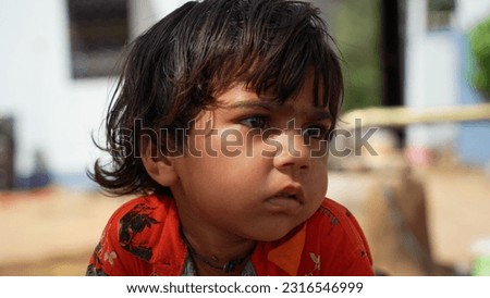 Unhappy small child kid orphan feel lonely abandoned, outcast or loner miss parents, children drama, volunteer concept Royalty-Free Stock Photo #2316546999