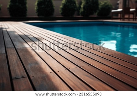 Empty wooden deck with swimming pool Royalty-Free Stock Photo #2316555093
