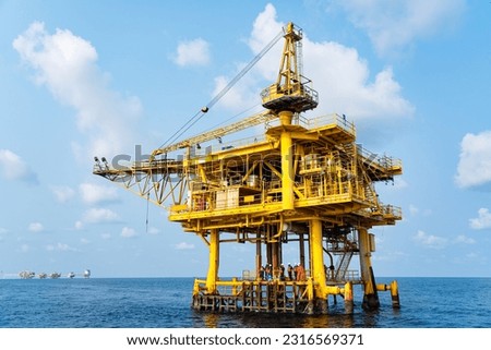 Offshore oil and gas wellhead remote platform which produced raw material for sent to onshore refinery, power generation and petrochemical industry. Royalty-Free Stock Photo #2316569371