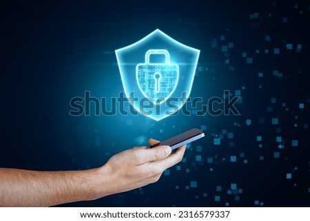 Concept of data privacy and protection with front view on digital glowing padlock, keyhole and shield above man hand with smartphone on abstract dark pixel background