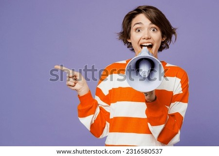 Young caucasian woman wear casual clothes sweatshirt hold in hand megaphone scream announces discounts sale Hurry up isolated on plain pastel light purple background studio portrait. Lifestyle concept Royalty-Free Stock Photo #2316580537