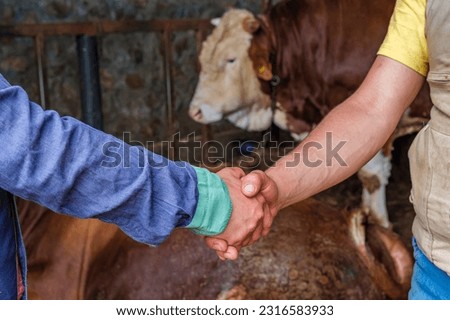 The bargain between the owner and the man who bought the sacrifice for Eid. Many animal sales for sacrifice Royalty-Free Stock Photo #2316583933