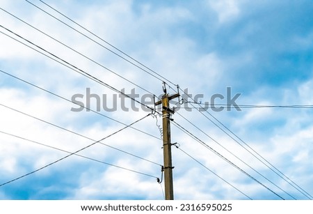 Power electric pole with line wire on colored background close up, photography consisting of power electric pole with line wire under sky, line wire in power electric pole for residential buildings Royalty-Free Stock Photo #2316595025