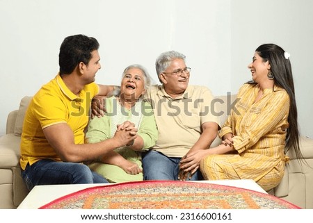 Indian sweet happy family at home Royalty-Free Stock Photo #2316600161