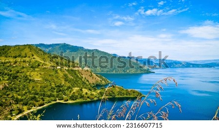 beautiful view of lake toba with blue sky background