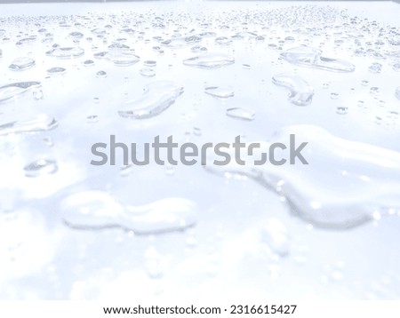 Beautiful white background with sparkling water Royalty-Free Stock Photo #2316615427