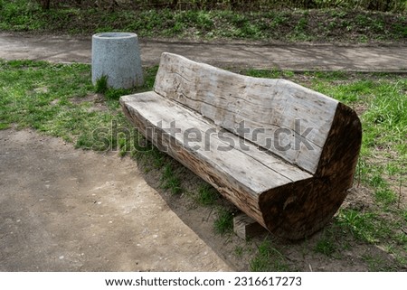 Old Shabby Wooden Bench in Park Made of a Single Tree Trunk, Outdoor Architecture, Wood Benches, Outdoor Chair, Public Furniture, Rustic Bench in Recreation Area Royalty-Free Stock Photo #2316617273