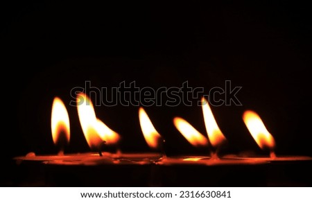 Candle flame on a black background religious ceremony