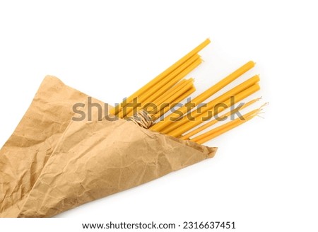 Parchment and church candles on white background, top view