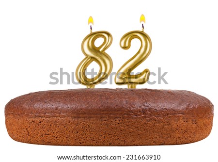 birthday cake with candles number 82 isolated on white background