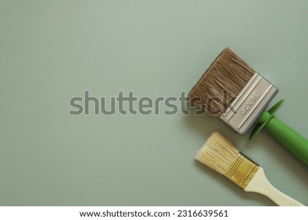Two brushes for painting walls top view flat lay.